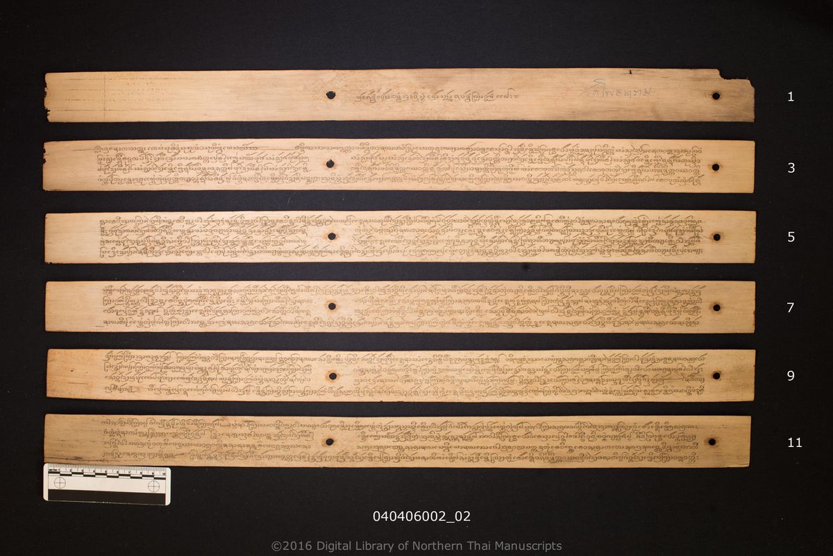 a page of Anisong khao salak sabap phanya wok, a palm-leaf Buddhist Canonical (พระไตรปิฎก) manuscript in Tham Lanna script, held at Wat Phothanaram, Chiang Rai; dated 1300 (Cunlasakkalat (CS))