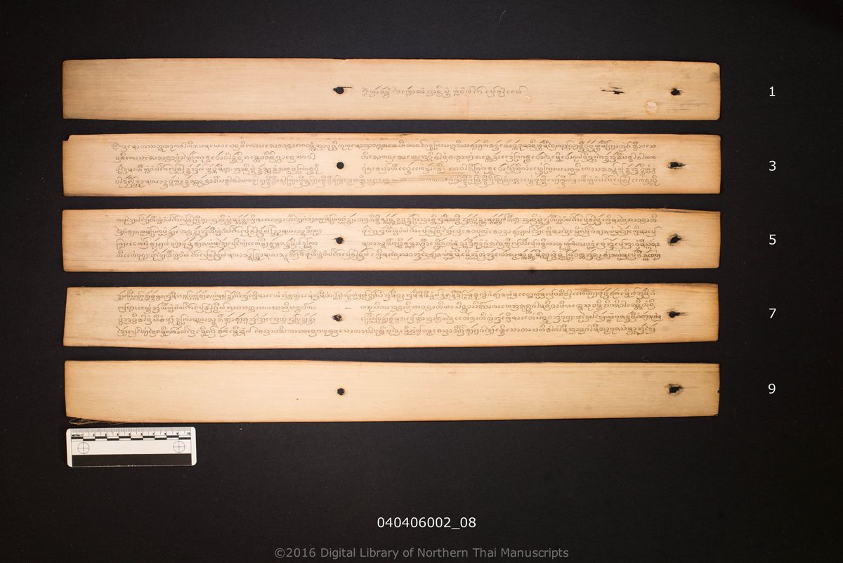 a page of Anisong lua lae fai pen tan, a palm-leaf Buddhist Canonical (พระไตรปิฎก) manuscript in Tham Lanna script, held at Wat Phothanaram, Chiang Rai