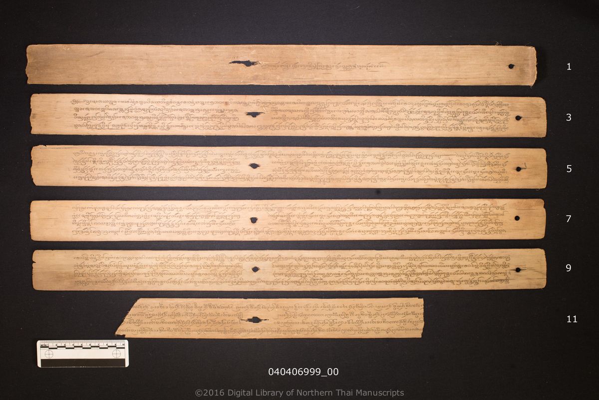 a page of Anisong pham tan khao bat com ha luk, a palm-leaf Buddhist Canonical (พระไตรปิฎก) manuscript in Tham Lanna script, held at Mae Can District