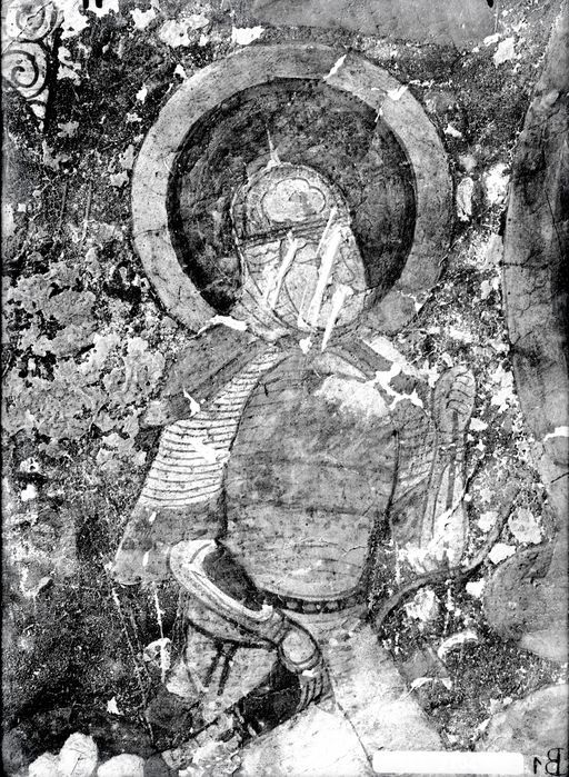 B 1: Kniender Ritter mit Helm und gepanzertem Oberkörper mit Nimbus nach links gewandt zu auf Lotosthron sitzendem Buddha in Mandorla, in Berglandschaft