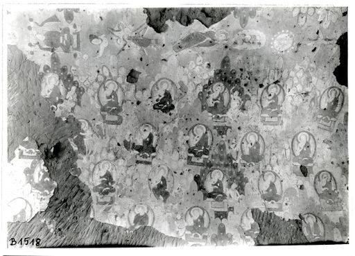 B 1518: Himmelskörper, Windgott, Garuḍa, fliegende Buddhas zwischen Belehrungsszenen und Legenden in Berglandschaften