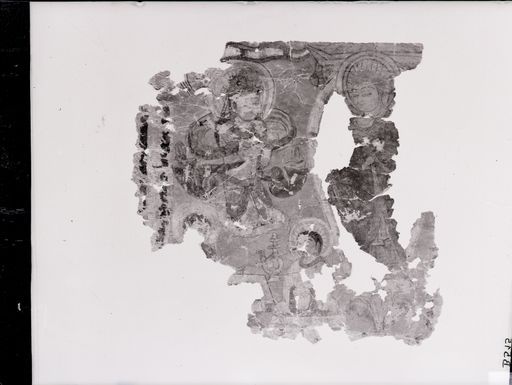 B 515: Bruchstück eines sogdischen buddhistischen Textes mit Miniatur: (Av.) Buddha, Bodhisattva und zwei Mönche auf blauem Grund auf der Rückseite ein mittelpersischer buddhistischer Text