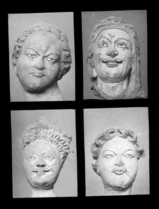 T 418: Vier Männerköpfe, darunter 1 Mann mit Löwenhelm